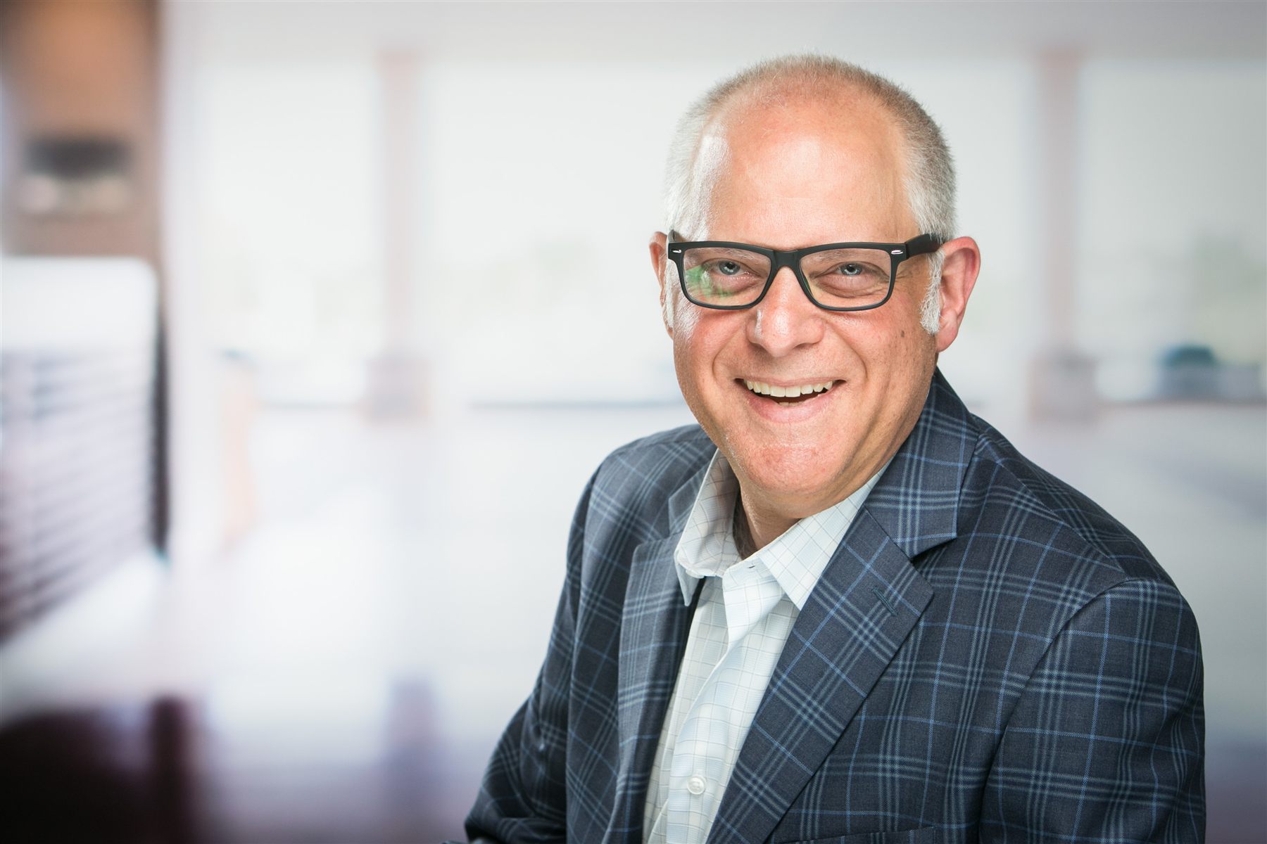 Professional headshot session at a corporate office — studio lighting setup