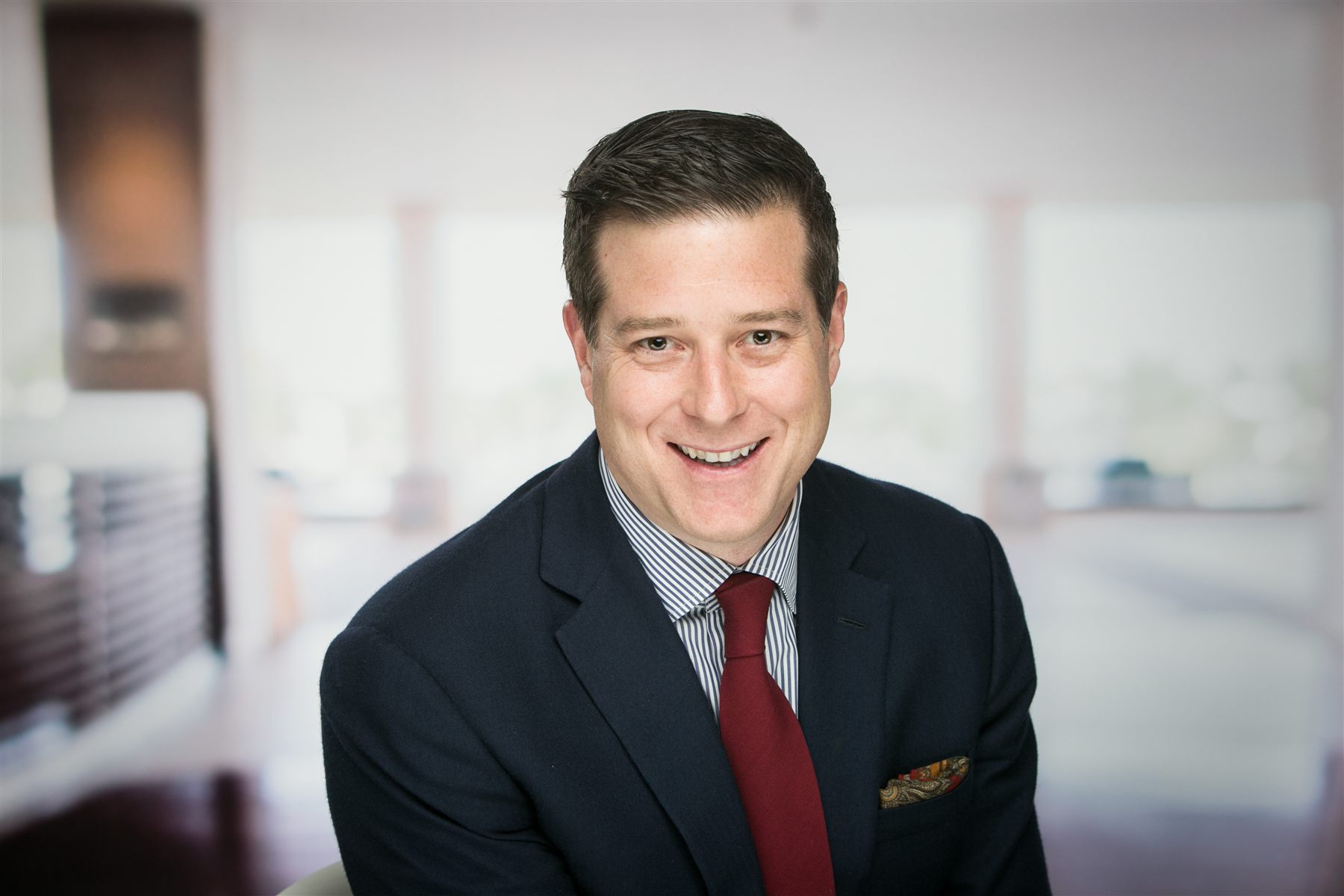 Professional headshot captured at a corporate event — the same studio-quality lighting used at SKO days