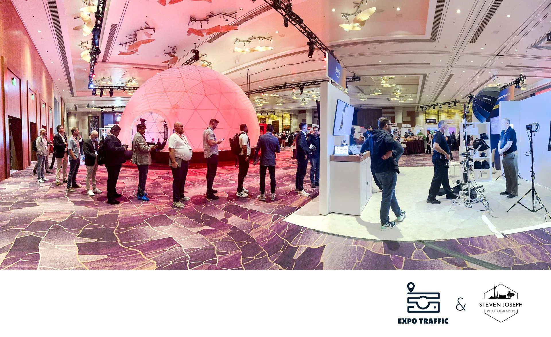 Attendee queue stretching through a major Las Vegas convention hall booth