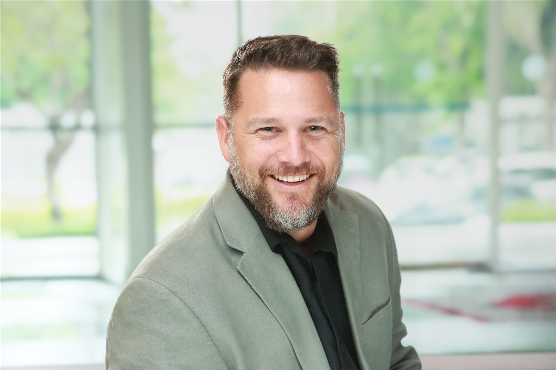 Professional headshot session — fast digital delivery, consistent style across team